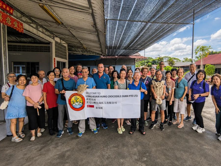Edufarm group at Long Kuan Hung Crocodile Farm with the farm welcome banner