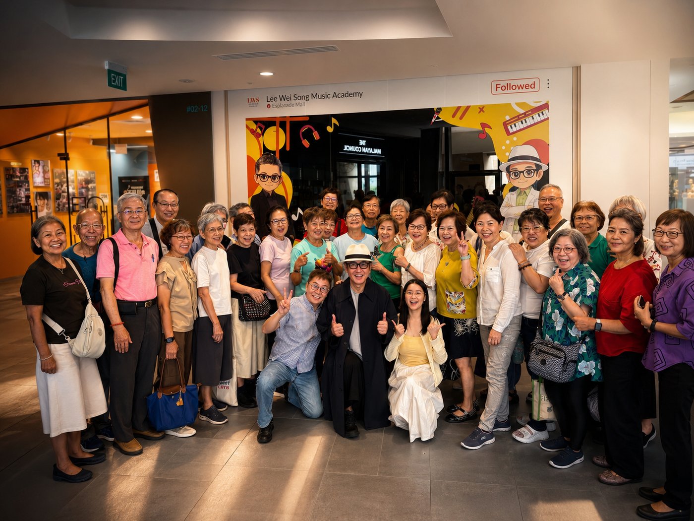 A group of seniors with songwriter Lee Wei Song outside the Lee Wei Song Music Academy at Esplanade Mall during an Edufarm Active Ageing Music Experience