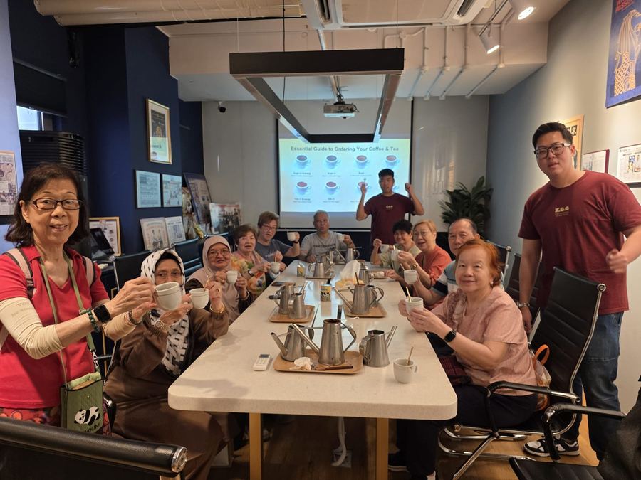 Group of seniors tasting traditional kopi at heritage roastery