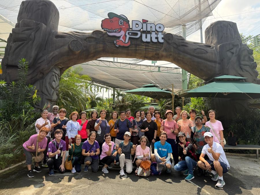 Seniors enjoying Dino Putt mini-golf excursion with Edufarm