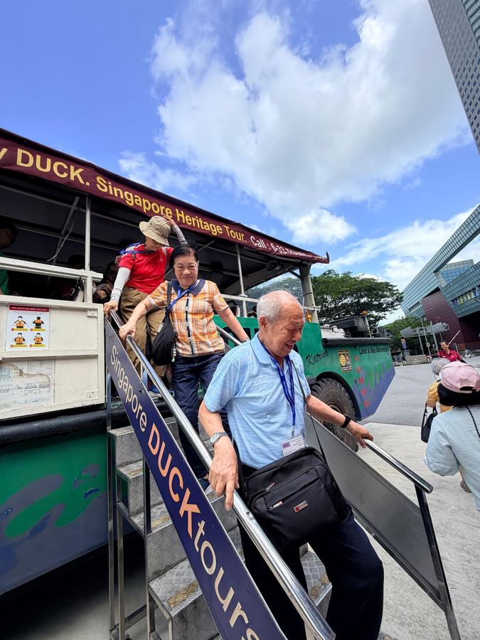 Seniors stepping off the Singapore DUCKtours Heritage Tour vehicle