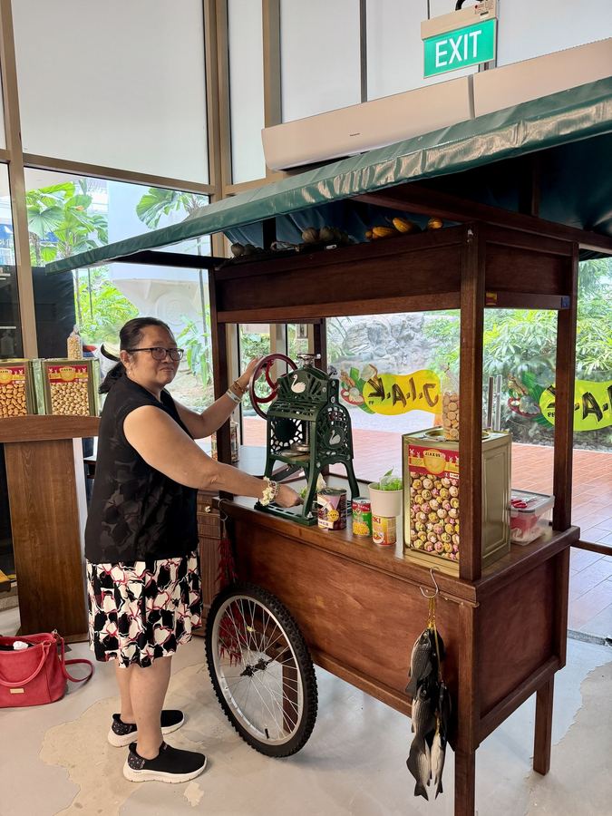 Senior operating a vintage ice-shaving hawker cart at JIAK99 Heritage Hawker Experience