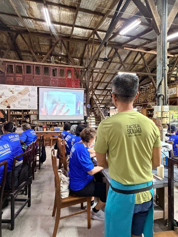 Seniors group watching a handbuilding pottery demonstration at Thow Kwang Pottery Jungle