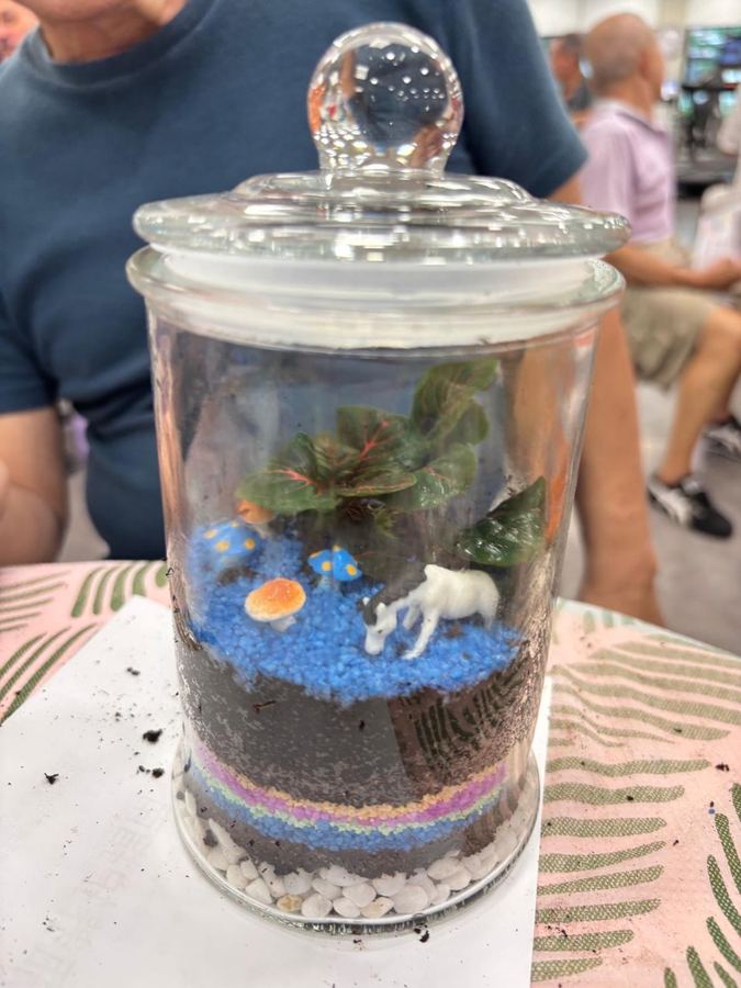 Senior participant crafting a terrarium at Edufarm workshop