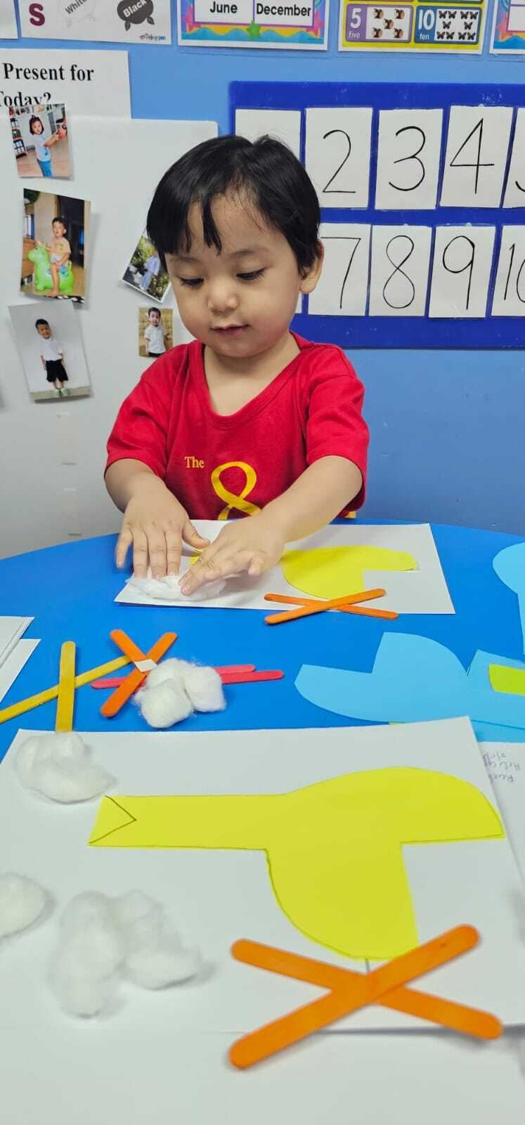 A Star Tots boy making a fluffy cotton-wool duck craft